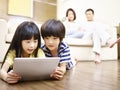 Asian children using digital tablet Royalty Free Stock Photo