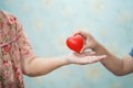 Asian children young kid give red heart strong health to old mother lady with love. Royalty Free Stock Photo