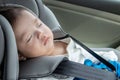 Asian Chinese baby boy asleep while in child safety car seat Royalty Free Stock Photo