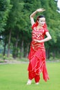 Asian Chinese beauty belly dancer dancing on lawn Royalty Free Stock Photo