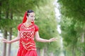 Asian Chinese beauty belly dancer in red dress with veil Royalty Free Stock Photo