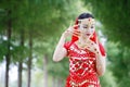 Asian Chinese beauty belly dancer in red dress with veil Royalty Free Stock Photo