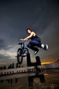 Asian Chinese Bicycle Guy doing a stunt on rooftop