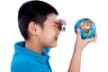 Asian Chinese Boy Looking At Globe Through Magnifying Glass