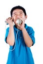 Asian Chinese Boy Playing with Tin Can Phone Royalty Free Stock Photo