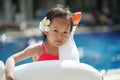 Asian chinese child with her float at a swimming pool Royalty Free Stock Photo