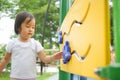 Asian Chinese child trying to play an outdoor game playground in park