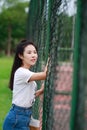 Asian Chinese university student play on the playground Royalty Free Stock Photo