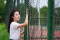 Asian Chinese university student play on the playground Royalty Free Stock Photo