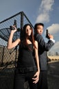 Asian chinese couple carrying guns on rooftop 2