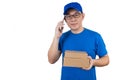 Asian Chinese delivery guy in uniform talking over mobile phone