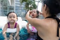 Asian Chinese family playing at the outdoor swimming pool Royalty Free Stock Photo