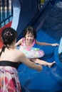 Asian Chinese family playing in swimming pool Royalty Free Stock Photo