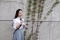 Relax Asian Chinese pretty girls wear student suit in school enjoy free time drink water in nature spring garden Royalty Free Stock Photo