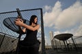 Asian Chinese Girl carrying a Pistol