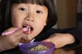 asian chinese girl eating noodles