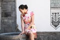 Asian Chinese girls wears cheongsam enjoy free time in ancient town Royalty Free Stock Photo