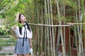 Asian Chinese Happy young cute adorable lovely student youth in a park garden outdoor in summer