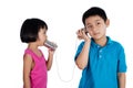 Asian Chinese Kid Playing with Tin Can Phone Royalty Free Stock Photo