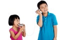 Asian Chinese Kid Playing with Tin Can Phone Royalty Free Stock Photo