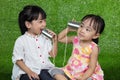 Asian Chinese Kids Playing with Tin Can Phone Royalty Free Stock Photo