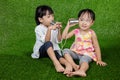 Asian Chinese Kids Playing with Tin Can Phone