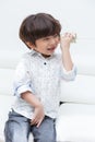 Asian Chinese little boy playing retro tin can phone