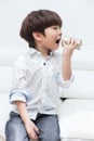 Asian Chinese little boy playing retro tin can phone Royalty Free Stock Photo