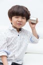 Asian Chinese little boy playing retro tin can phone Royalty Free Stock Photo