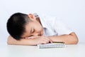 Asian Chinese Little Boy Wearing Student Uniform Sleeping on Desk Royalty Free Stock Photo