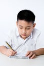 Asian Chinese Little Boy Wearing Student Uniform Writting Homework Royalty Free Stock Photo