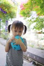 Happy little cute lovely girl Chinese child smile laugh blow balloon have fun at summer park nature happiness childhood Royalty Free Stock Photo