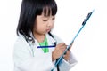 Asian Chinese Little Doctor Writting On Clip Board Royalty Free Stock Photo