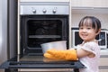Asian Chinese little girl baking cake Royalty Free Stock Photo