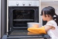 Asian Chinese little girl baking cake Royalty Free Stock Photo