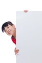 Asian Chinese little girl behind a blank white board Royalty Free Stock Photo