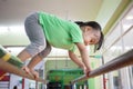 Asian Chinese little girl climbing on parallel bars Royalty Free Stock Photo