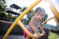 Asian Chinese little girl climbing stepladder