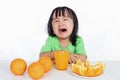 Asian Chinese little girl crying for orange juice Royalty Free Stock Photo