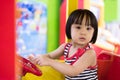 Asian Chinese Little Girl Driving Toy Bus Royalty Free Stock Photo