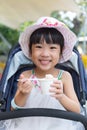 Asian Chinese little girl eating ice cream Royalty Free Stock Photo