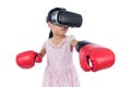 Asian Chinese little girl experiencing virtual reality with boxing gloves