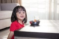 Asian Chinese little girl having breakfast with milk Royalty Free Stock Photo