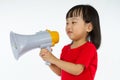 Asian Chinese little girl holding megaphone Royalty Free Stock Photo