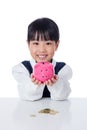 Asian Chinese little girl holding piggy bank Royalty Free Stock Photo