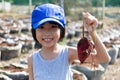 Asian Chinese Little Girl holding purple potato in organic farm Royalty Free Stock Photo