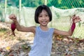 Asian Chinese Little Girl holding purple potato in organic farm Royalty Free Stock Photo