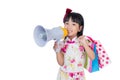 Asian Chinese little girl holding shopping bags and loudspeaker Royalty Free Stock Photo