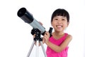 Asian Chinese little girl holding a telescope Royalty Free Stock Photo