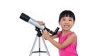 Asian Chinese little girl holding a telescope Royalty Free Stock Photo